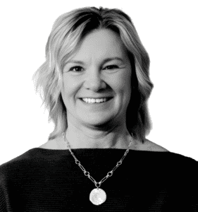 Smiling woman with short blonde hair wearing a necklace, representing WalkPort About section.