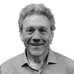 Smiling man in business casual attire for WalkPort About section.