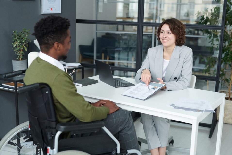 Funding discussion with a professional in an office setting.