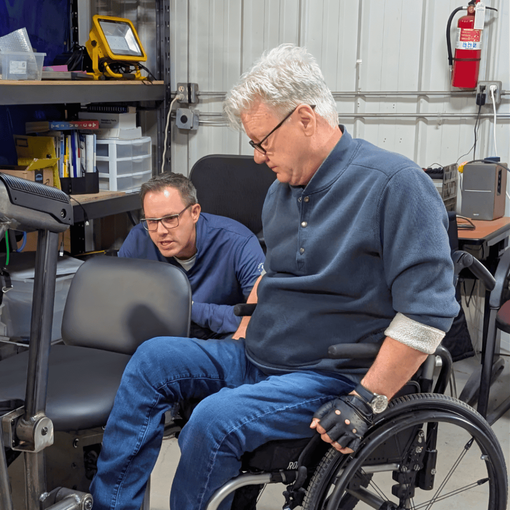 Assistive technology workshop with individuals using wheelchairs and adaptive devices.
