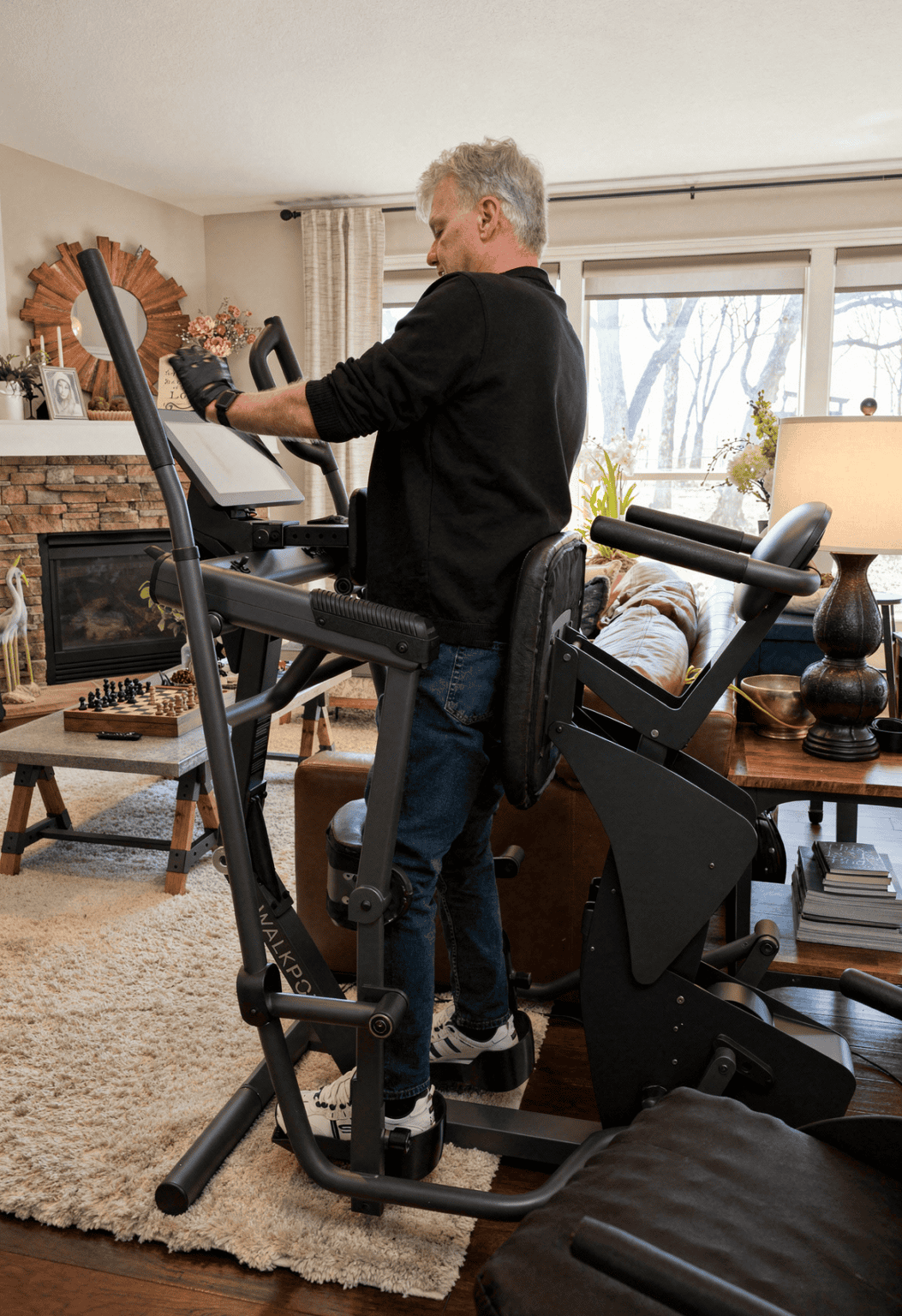 WalkPort founder Alan Tholkes standing in the WalkPort Supported Walk Station at home