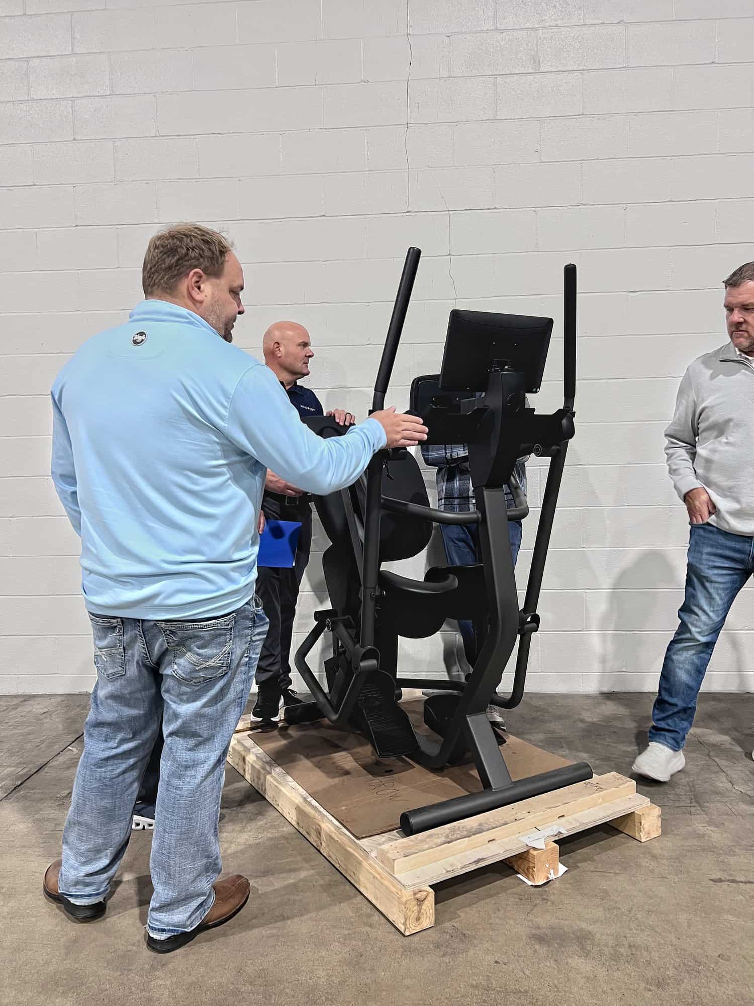Guests look over a first production WalkPort unit