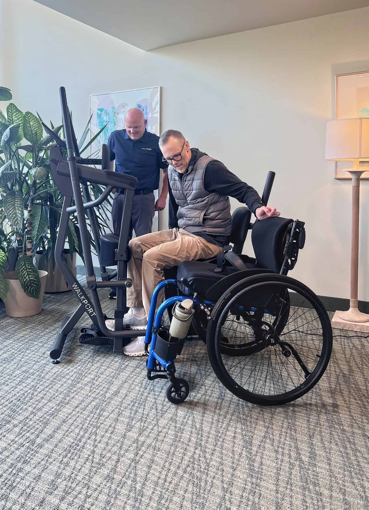 A guest transfers from his wheelchair onto the WalkPort seat
